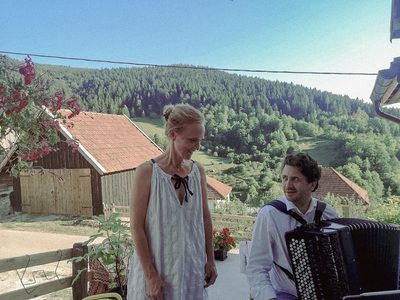 Goran Stevanović (accordion) and Ingala Fortagne (voice) &middot; rehearsal on the terrace &middot; July 2024
